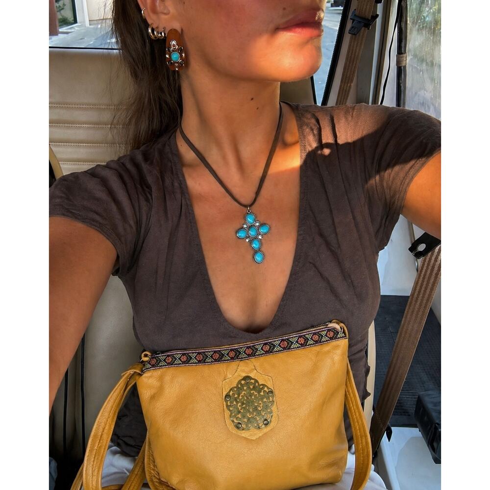 Golden Mustard Leather Crossbody Bag with Decorative Medallion
